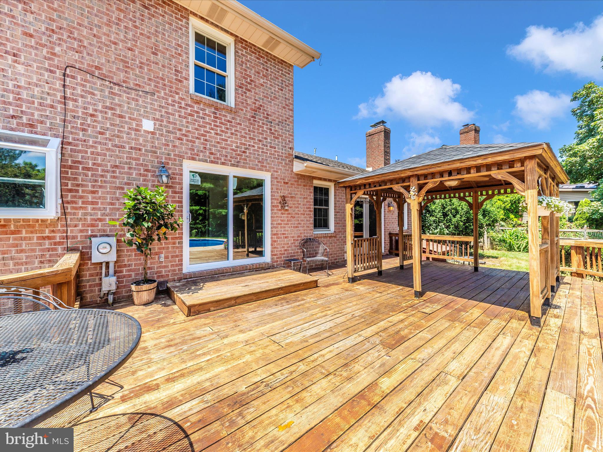 8395 Buckeye Court Frederick, MD 21702 - Photo 52 of 56 a porch with seating space and yard in the back