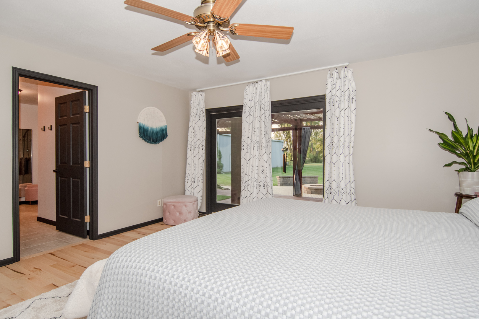1450 Airport Road Morris, IL 60450 - Photo 24 of 43 a bedroom with a large bed and a chandelier