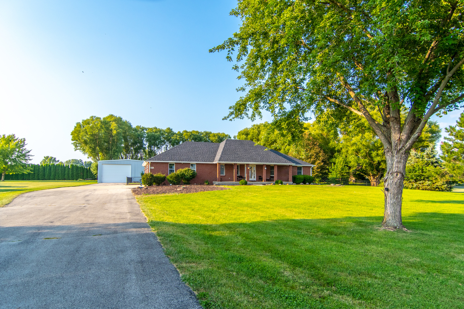 1450 Airport Road Morris, IL 60450 - Photo 3 of 43 a house with swimming pool in front of it