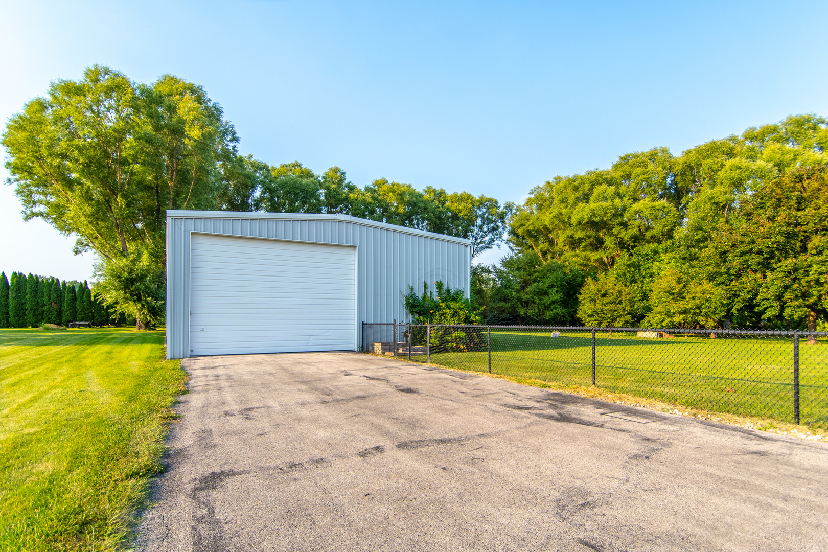 1450 Airport Road Morris, IL 60450 - Photo 6 of 43 a view of a swimming pool with an outdoor space and seating area