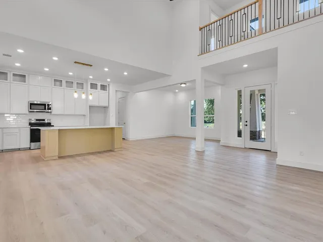 a view of a kitchen with a sink and a stove top oven