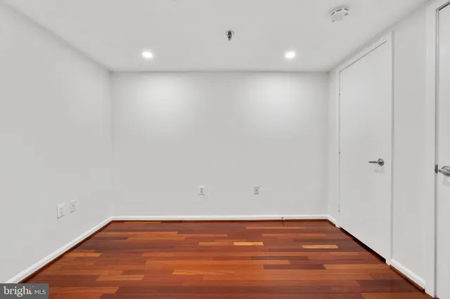 a view of room with wooden floor