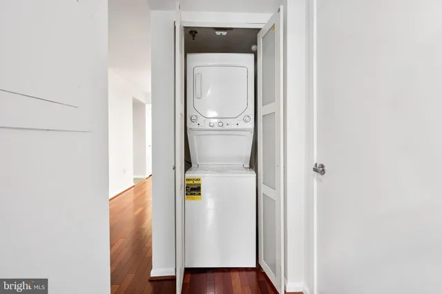 a view of a hallway with wooden floor and entryway