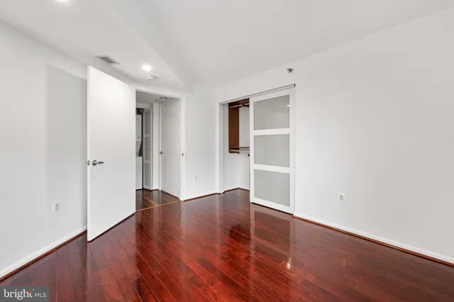 an empty room with wooden floor