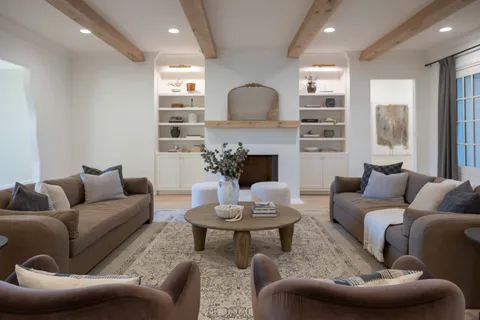 a bedroom with bed and wooden floor