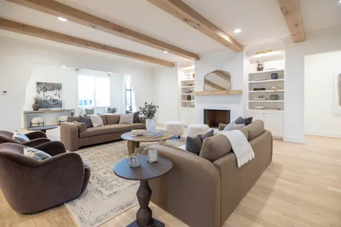 a white bath tub sitting next to a white toilet