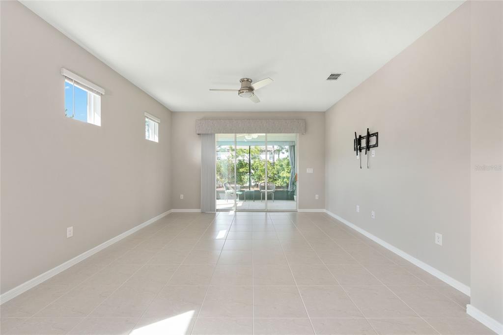 5966 Southwest 93rd Circle Ocala, FL 34481 - Photo 12 of 41 wooden floor in an empty room with a window