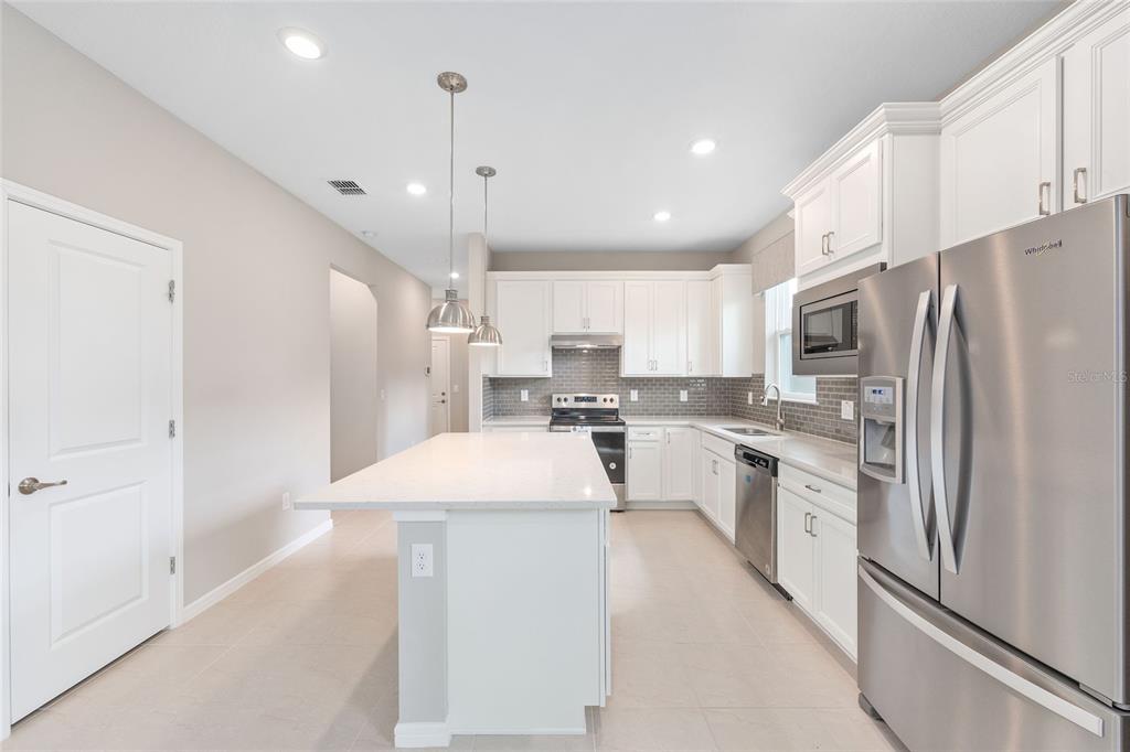 5966 Southwest 93rd Circle Ocala, FL 34481 - Photo 20 of 41 a large kitchen with cabinets
