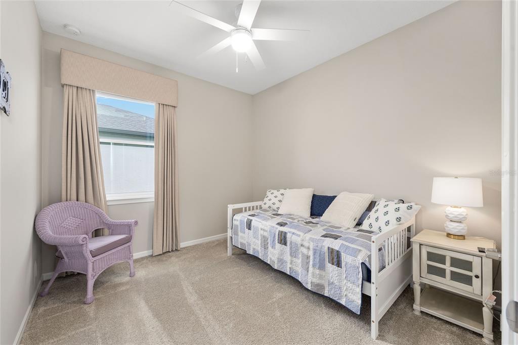 5966 Southwest 93rd Circle Ocala, FL 34481 - Photo 21 of 41 a bed room with a bed and a chair