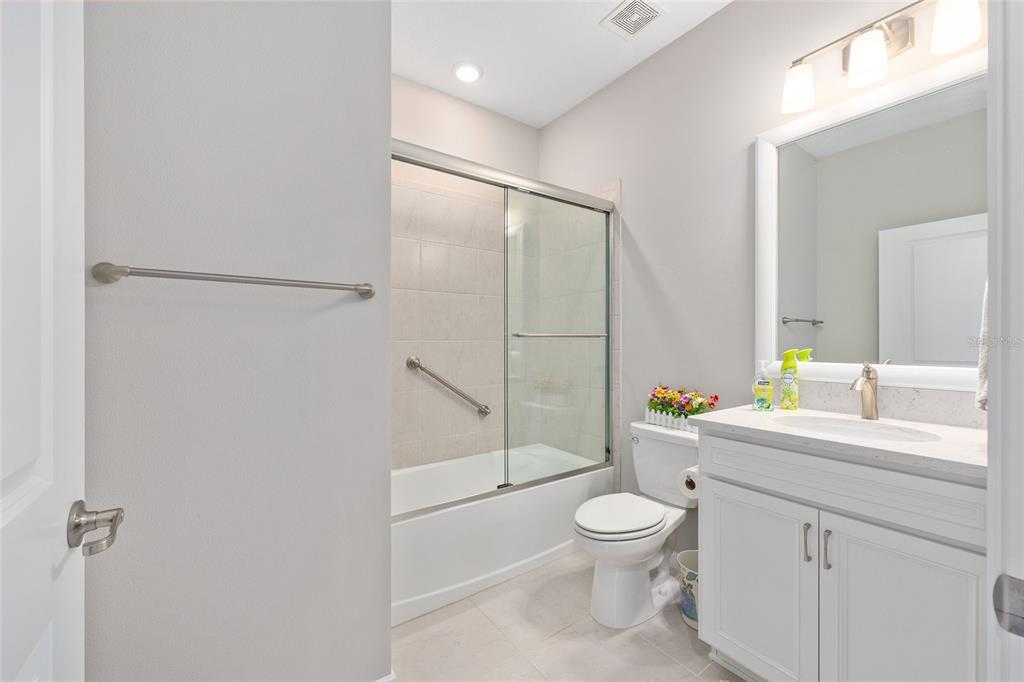 5966 Southwest 93rd Circle Ocala, FL 34481 - Photo 23 of 41 a bathroom with a toilet a sink and a mirror