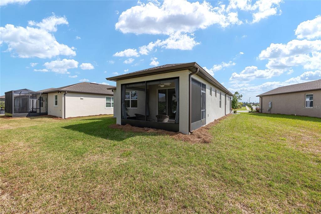 5966 Southwest 93rd Circle Ocala, FL 34481 - Photo 34 of 41 a view of a house with a backyard