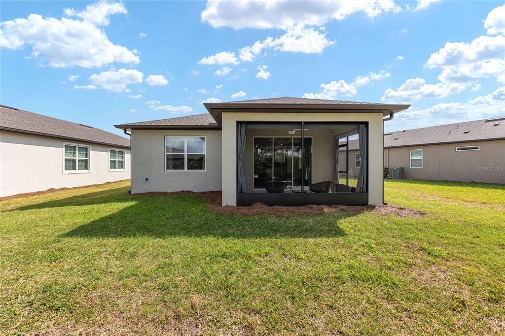 5966 Southwest 93rd Circle Ocala, FL 34481 - Photo 36 of 41 a view of a house with backyard and porch