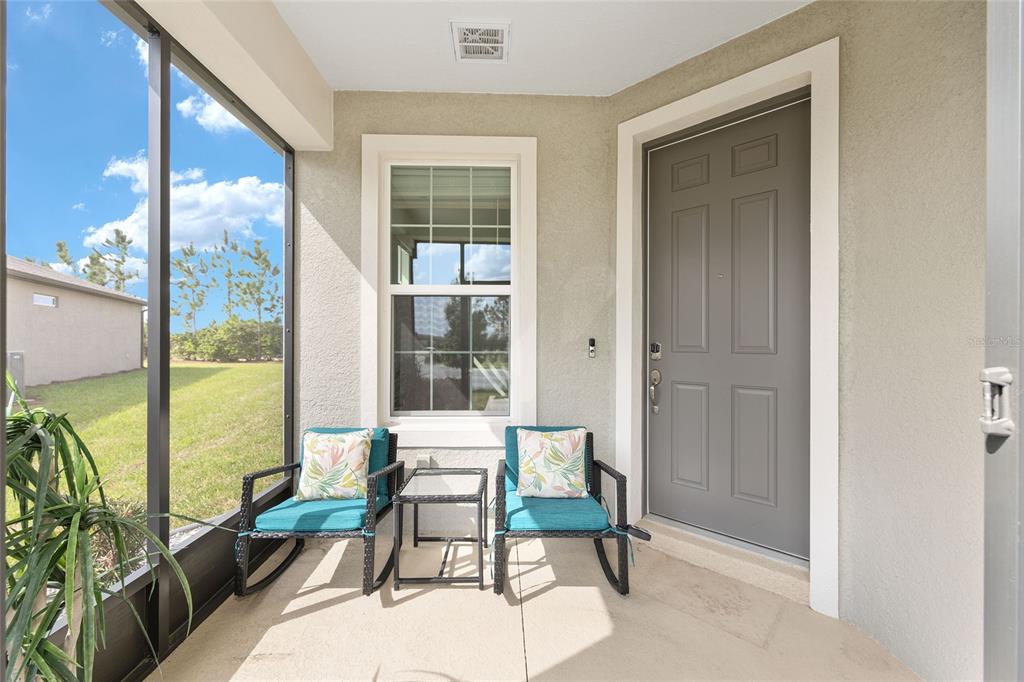 5966 Southwest 93rd Circle Ocala, FL 34481 - Photo 6 of 41 a balcony with chairs and with furniture