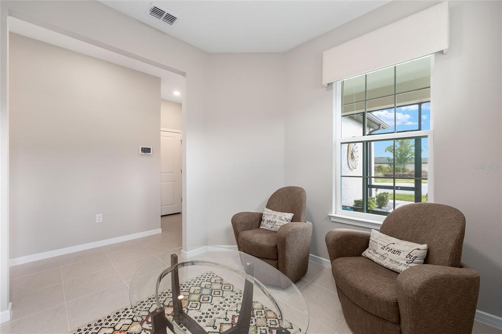 5966 Southwest 93rd Circle Ocala, FL 34481 - Photo 8 of 41 a living room with furniture and a window