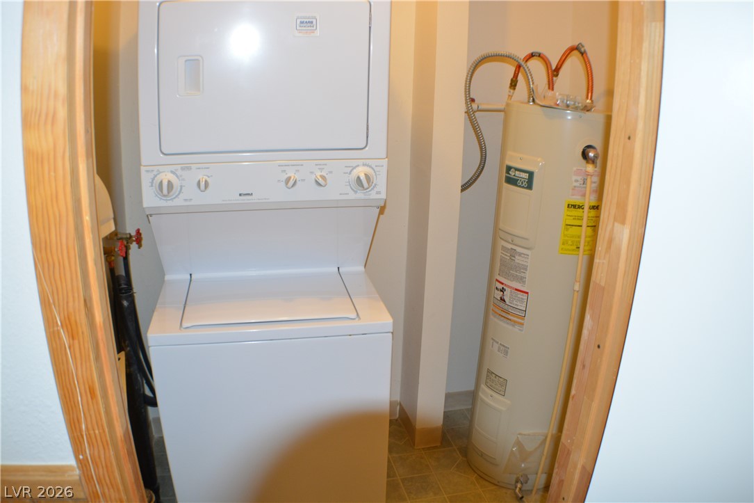 1321 Trout Canyon Road Las Vegas, NV 89124 - Photo 18 of 50 A dedicated utility space with efficient stacked laundry appliances and water heater.