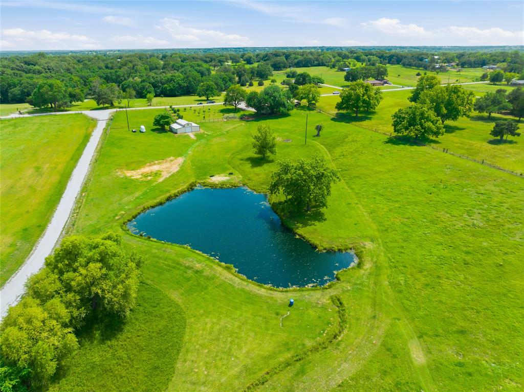 235 Magnus Road Denison, TX 75021 - Photo 8 of 35 a view of a golf course with a garden