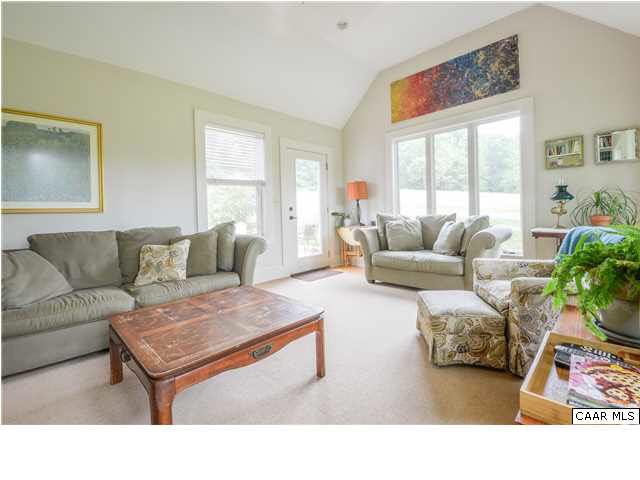 3938 Richmond Road Keswick, VA 22947 - Photo 11 of 37 The sun room, with cathedral ceiling, is bright and open, yet proportional to the intimate scale of the home. An elegant built-in unit with shelving & cupboard can be used for decorative display & as an entertainment unit.