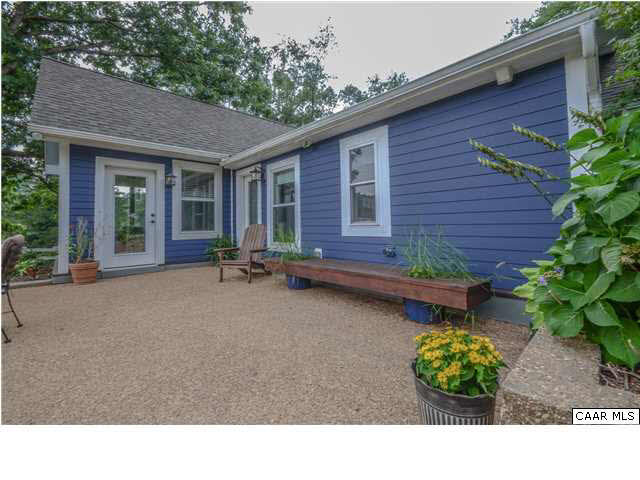 3938 Richmond Road Keswick, VA 22947 - Photo 12 of 37 Sink in, relax, & enjoy soothing views of the fenced pasture & barn from the oversized triple panel casement windows. When you're ready for some fresh air, step out the glass door onto the patio.