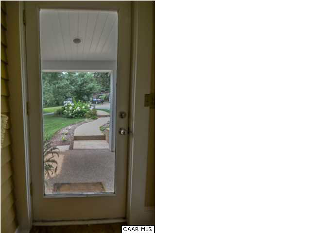 3938 Richmond Road Keswick, VA 22947 - Photo 20 of 37 The "real" entrance to the home is the side door from the parking area. The cozy mud room, w/full bath & laundry attached, is ideal for the equestrian & farm life, yet also oozes charm. Exposed siding & ceramic tile floor are fresh & bright.