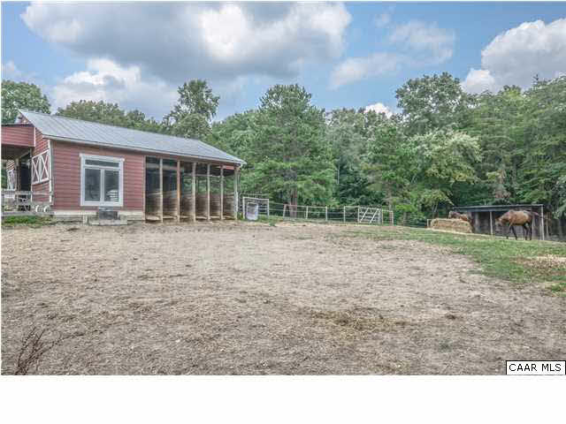 3938 Richmond Road Keswick, VA 22947 - Photo 33 of 37 Six chutes line the opposite side of the aisle, opening onto a fenced enclosure. A convenient office is located just inside the entry with utility sink and cabinetry.