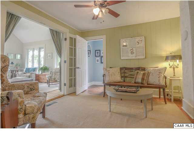3938 Richmond Road Keswick, VA 22947 - Photo 9 of 37 A delightful, intimate sitting room is the hub through which the the main floor flows. It's a perfect spot to settle in with a good book or catch a quick quiet moment while working in the kitchen.