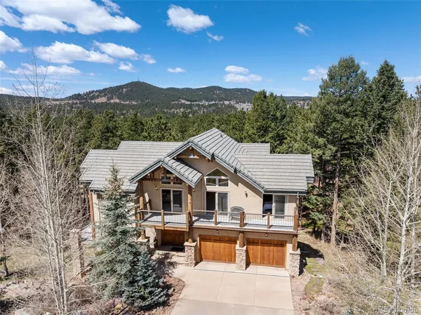 a aerial view of a house with a yard
