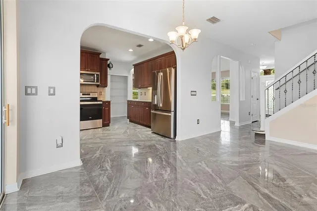a view of a livingroom with a kitchen