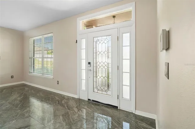 a view of an empty room with a window