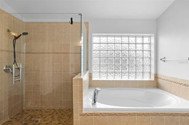 a white bath tub sitting next to a window