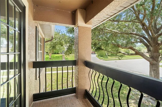 a view of balcony with wooden floor
