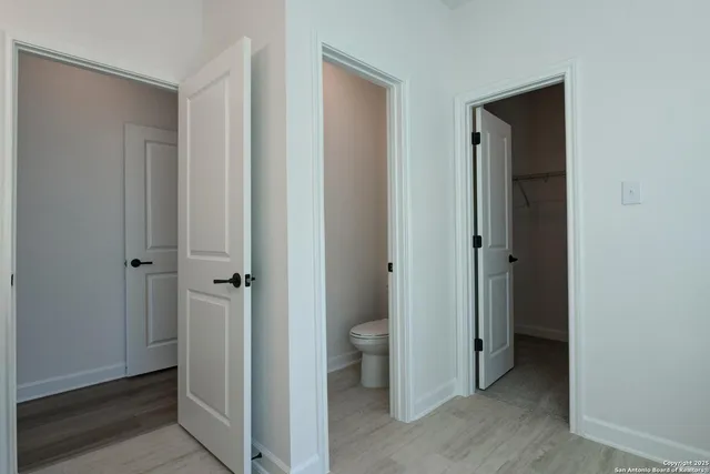 a bathroom with a granite countertop sink a mirror and a bathtub