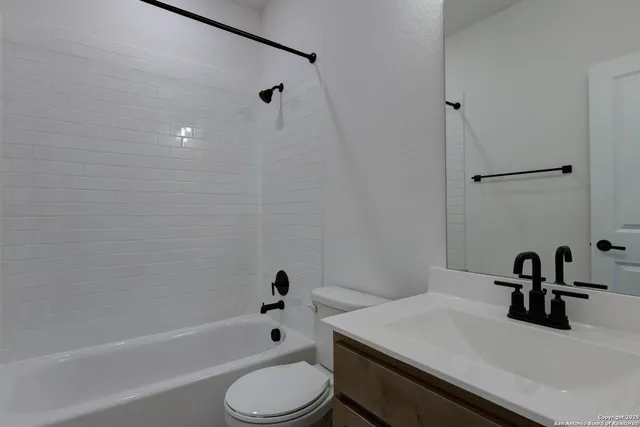 a room with a white wall and a window