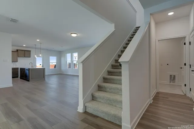 a view of kitchen with cabinets and wooden floor