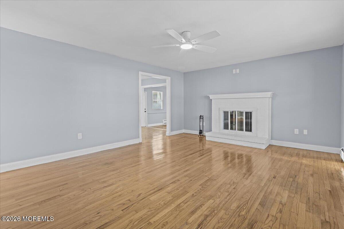 417 Riverview Road Forked River, NJ 08731 - Photo 5 of 26 wooden floor in an empty room with a window
