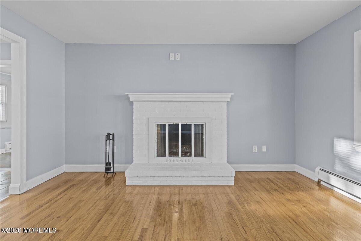 417 Riverview Road Forked River, NJ 08731 - Photo 6 of 26 a view of an empty room and wooden floor