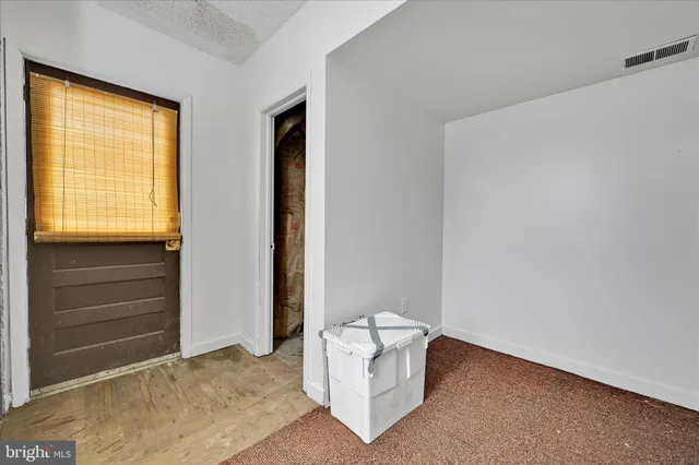 a living room with a couch and a window