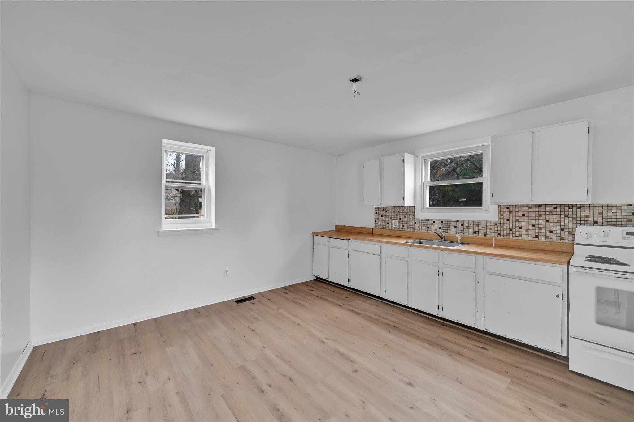 4301 Aston Mills Road Aston, PA 19014 - Photo 16 of 33 a large white kitchen with sink and cabinets