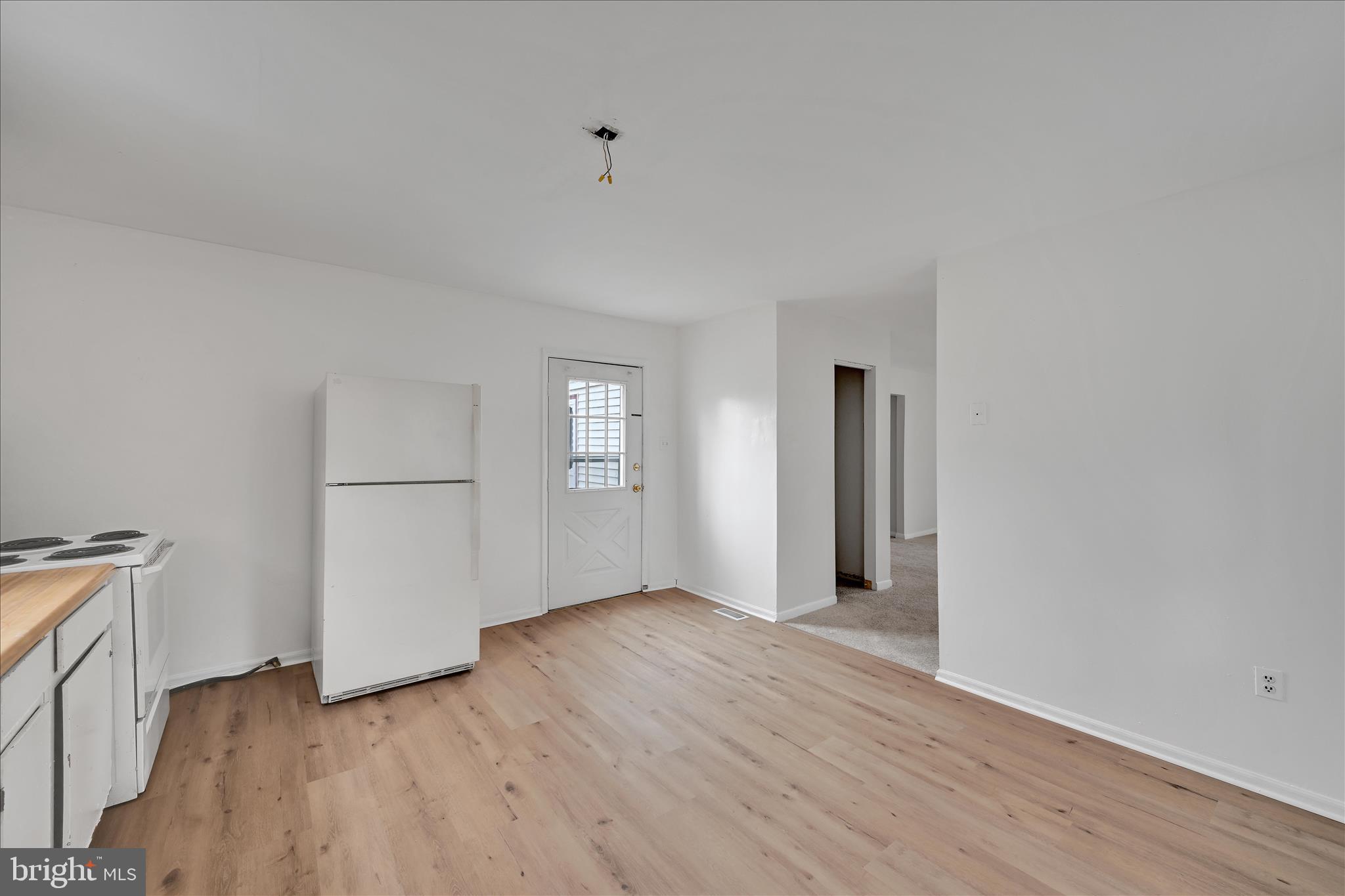4301 Aston Mills Road Aston, PA 19014 - Photo 18 of 33 an empty room with wooden floor and windows