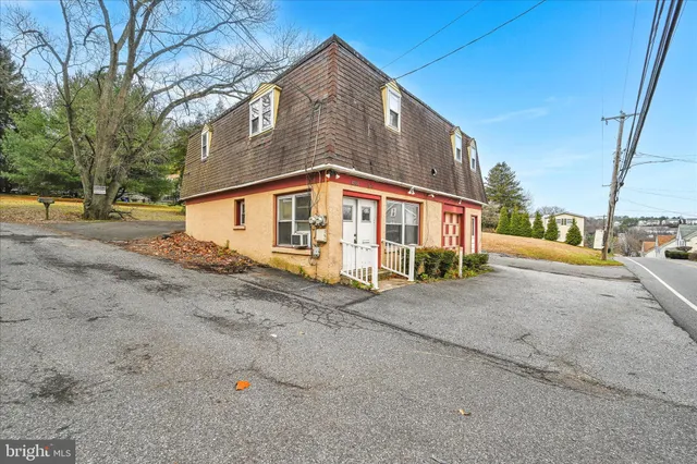 a view of a house with a street