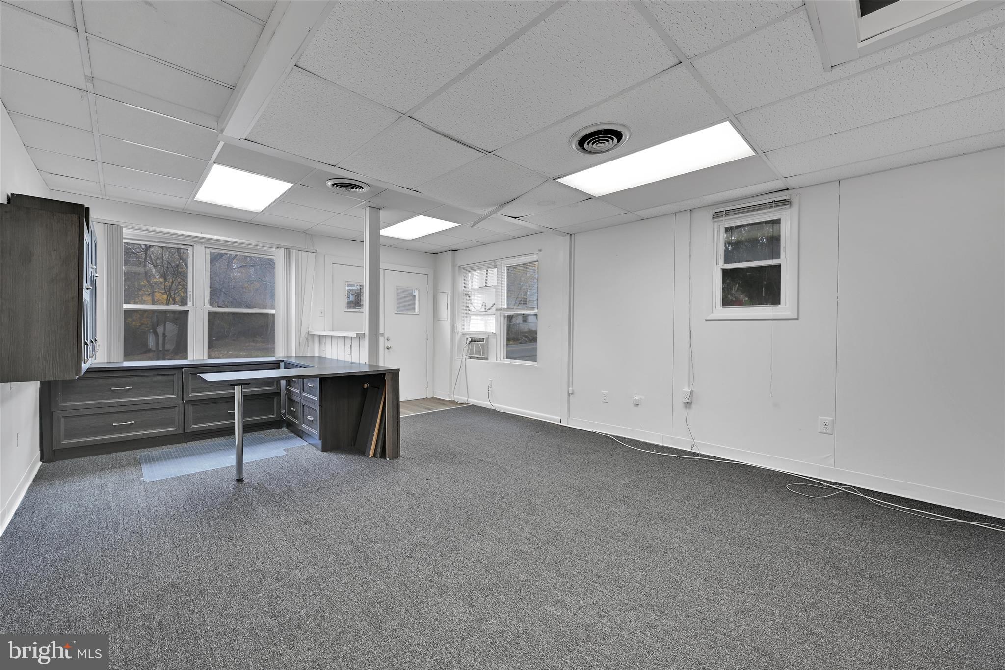 4301 Aston Mills Road Aston, PA 19014 - Photo 6 of 33 a view of an empty room with window and a ceiling fan