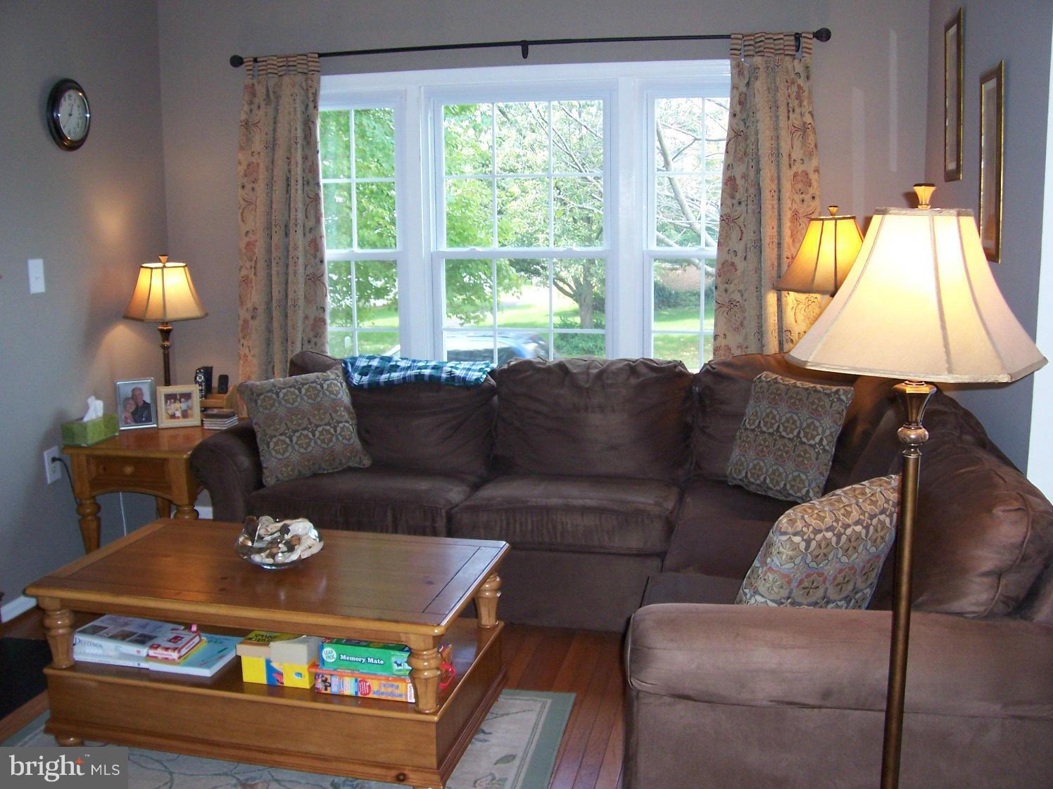 10429 Labrador Loop Manassas, VA 20112 - Photo 14 of 28 Bright Living Room with Wood Burning Fireplace