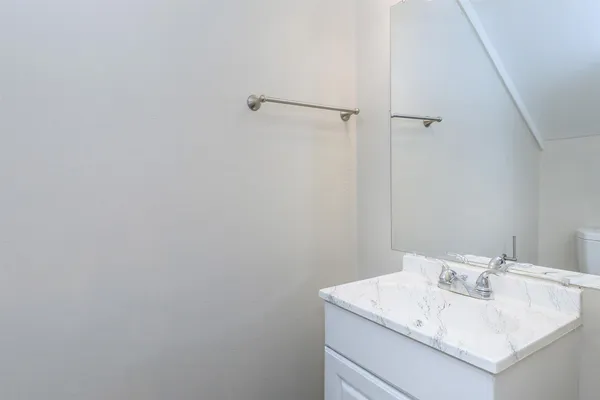 a bathroom with a sink and vanity
