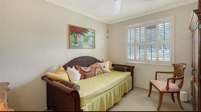 a bedroom with furniture and a window