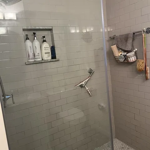a bathroom with a bathtub and a shower