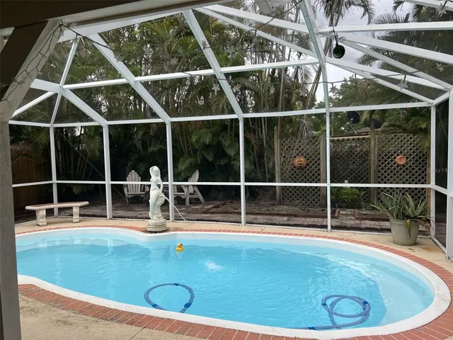a view of a swimming pool with an outdoor space