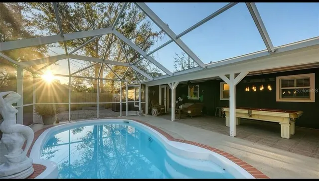 a view of a living room and bathroom