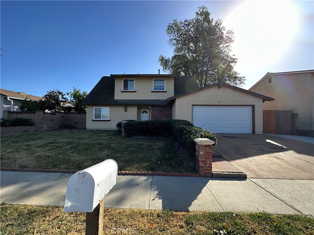 192 Ulysses Street Simi Valley, CA 93065 - Photo 1 of 1 a front view of a house with a yard