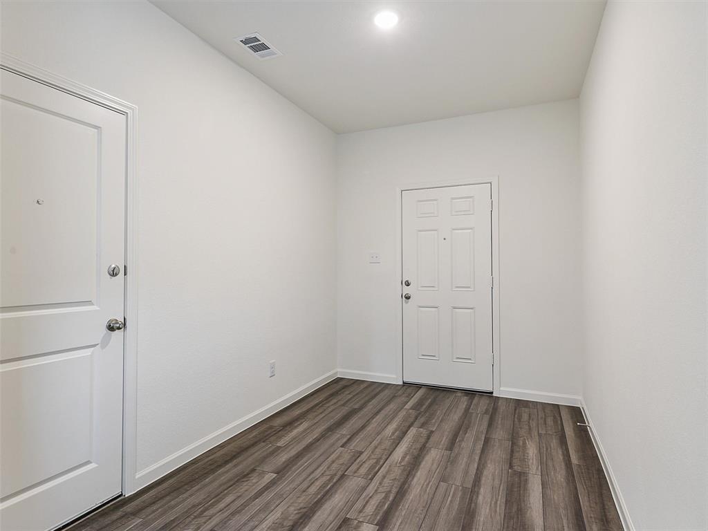 4510 Winecup Road Melissa, TX 75454 - Photo 4 of 22 Entryway featuring wood-finish flooring, crisp white walls, and bright overhead lighting