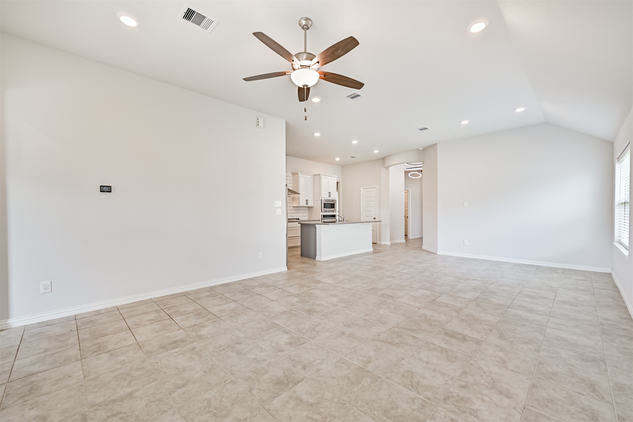 7019 Terra Drive Manvel, TX 77578 - Photo 17 of 41 an empty room with cabinet and a ceiling fan