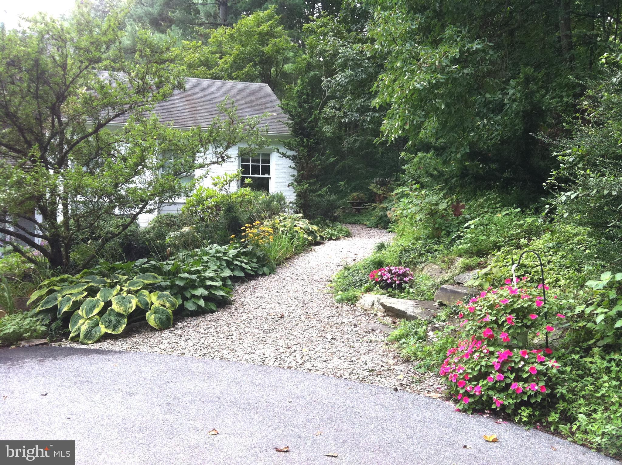 13808 Longnecker Road Glyndon, MD 21136 - Photo 2 of 40 Lovely walkways lined with beautiful blooms